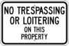 G 92 no trespassing or loitering on this property sign