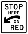 R10 6a stop here on red left arrow sign
